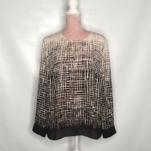 Vince Camuto top with geometrical pattern.